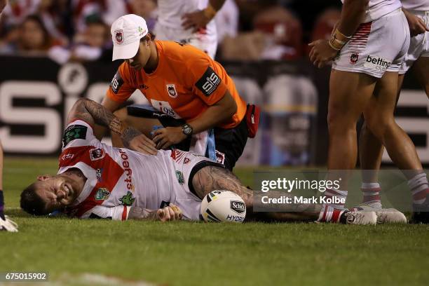 Josh Dugan of the Dragons receives attention from the trianer during the round nine NRL match between the St George Illawarra Dragons and the...