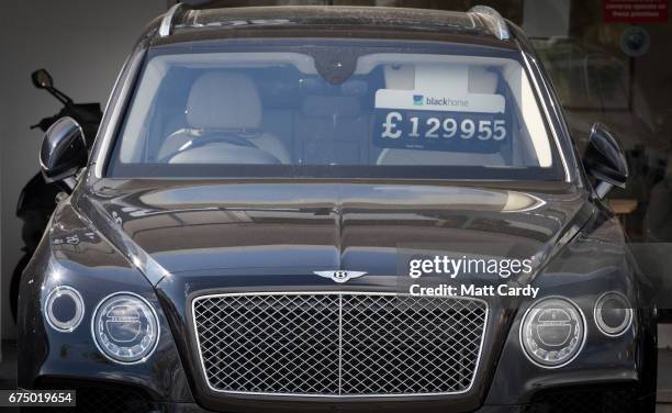 Luxury cars are offered for sale in St Aubin on April 13, 2017 near St Helier, Jersey. Jersey, which is not a member of the European Union, is one of...