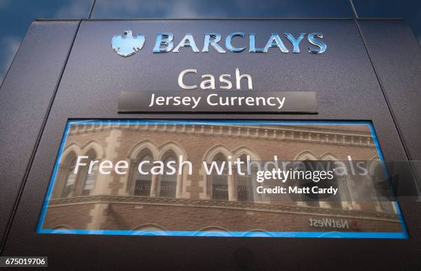 Signage is seen above a ATM cash machine outside a bank in St Helier on April 12, 2017 in St Helier, Jersey. Jersey, which is not a member of the...