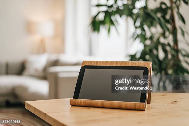 rack with tablet on tabletop - living room table stock pictures, royalty-free photos & images