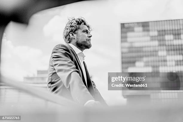 businessman standing on bridge - black and white people stock pictures, royalty-free photos & images