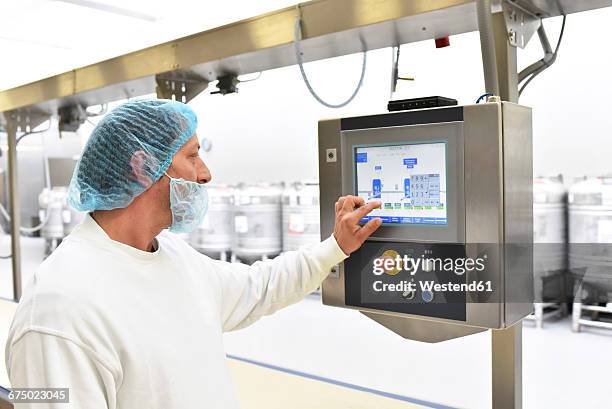 Baker Operating Machine Industrial Bakery Machine Photos and Premium High Res Pictures - Getty ...
