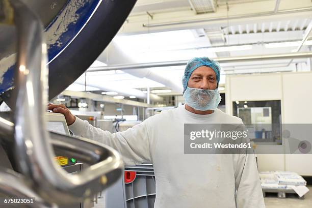 worker in an industrial bakery - hair net stock pictures, royalty-free photos & images