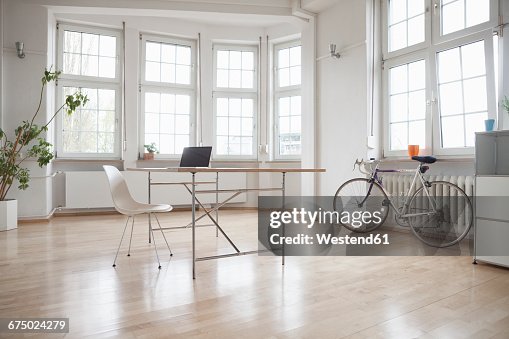 Laptop On Table In Sparse Office High-Res Stock Photo - Getty Images