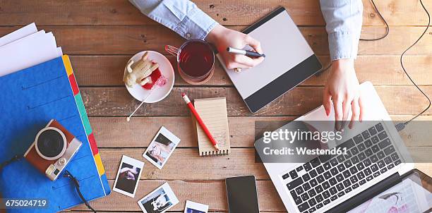 illustrator working at home using a graphics tablet - illustrator imagens e fotografias de stock