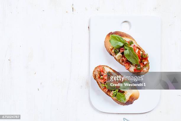 fresh bruschetta with ingredients - bruschetta foto e immagini stock
