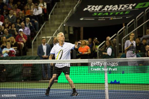 Musician Mike McCready in action against Bill Gates and Roger Federer at the Match For Africa 4 exhibition match at KeyArena on April 29, 2017 in...