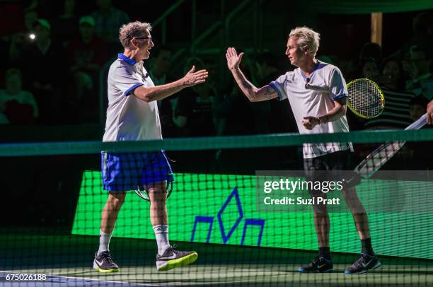 Bill Gates high fives Mike McCready at the Match For Africa 4 exhibition match at KeyArena on April 29, 2017 in Seattle, Washington.