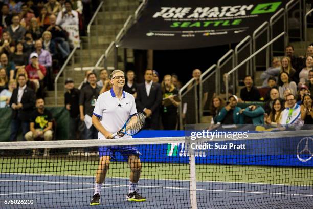 Bill Gates in action against Mike McCready and John Isner at the Match For Africa 4 exhibition match at KeyArena on April 29, 2017 in Seattle,...