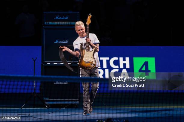 Musician Mike McCready plays the United States national anthem at the Match For Africa 4 exhibition match at KeyArena on April 29, 2017 in Seattle,...