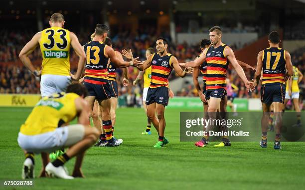 Taylor Walker, Eddie Betts and Josh Jenkins of the Crows celebrate a goal during the round six AFL match between the Adelaide Crows and the Richmond...