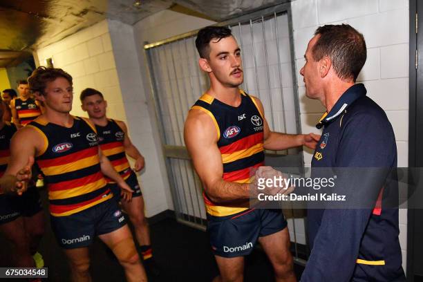 Adelaide Crows Senior Coach Don Pyke congratulates Taylor Walker and Rory Sloane of the Crows after the round six AFL match between the Adelaide...