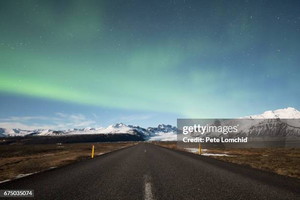 road in iceland with aurora - olafsvik stock pictures, royalty-free photos & images