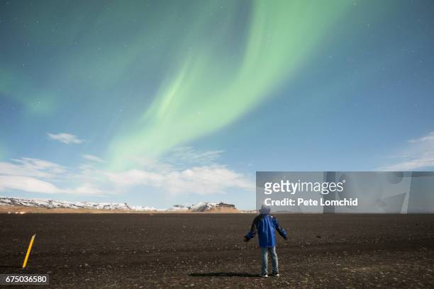 a man and aurora iceland - calancói imagens e fotografias de stock