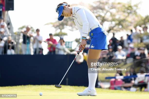 Ha-Neul Kim of South Korea putts on the 18th hole in the playoff during the final round of the CyberAgent Ladies Golf Tournament at the Grand Fields...