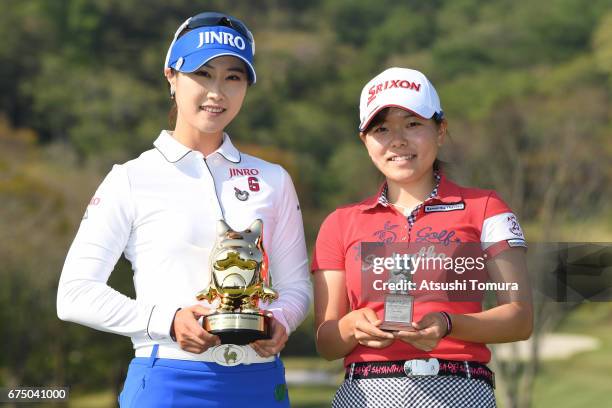 Ha-Neul Kim of South Korea and Minami Katsu of Japan pose with trophy during the CyberAgent Ladies Golf Tournament at the Grand Fields Country Club...