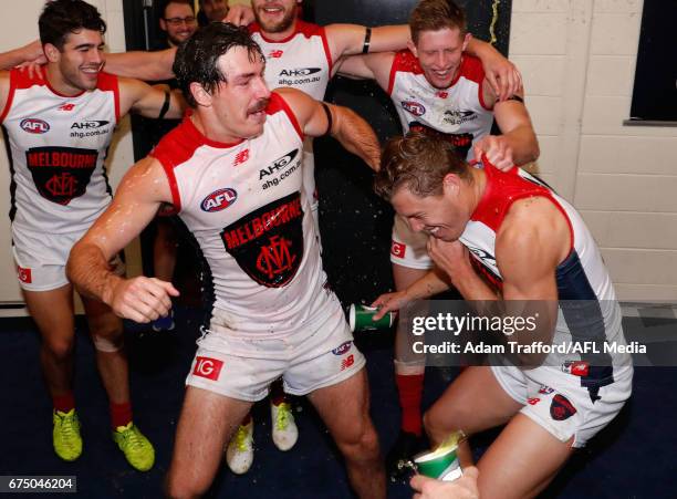Michael Hibberd of the Demons drags Jake Melksham of the Demons into the circle as he gets a Gatorade shower during the 2017 AFL round 06 match...