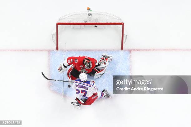 Craig Anderson of the Ottawa Senators makes a save against Ryan McDonagh of the New York Rangers in Game One of the Eastern Conference Second Round...