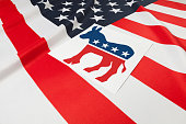 Series of USA ruffled flags with democratic party symbol over it