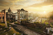 Roman Forum at sunrise, from left to right: Temple of Vespasian and Titus, church of Santi Luca e Martina, Septimius Severus Arch, ruins of Temple of Saturn.