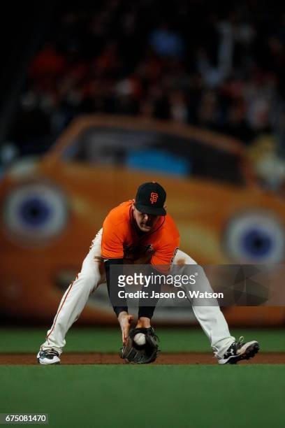 Conor Gillaspie of the San Francisco Giants fields a ground ball against the San Diego Padres during the fifth inning at AT&T Park on April 28, 2017...