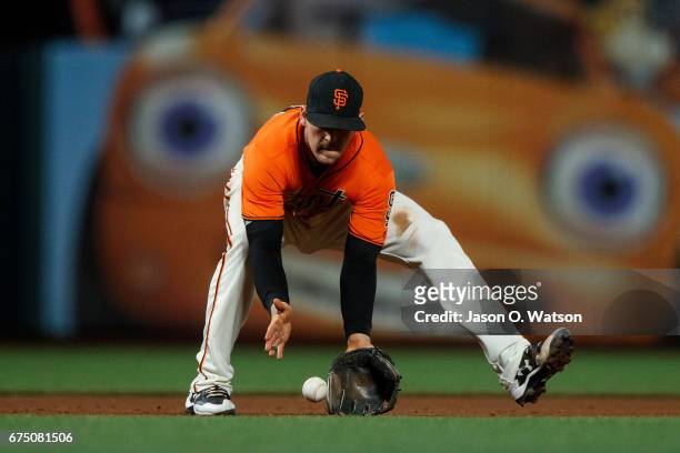 Conor Gillaspie of the San Francisco Giants fields a ground ball against the San Diego Padres during the fifth inning at AT&T Park on April 28, 2017...