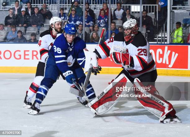 Kirby Rychel of the Toronto Marlies looks for a rebound off of Mackenzie Blackwood of the Albany Devils during game 4 action in the Division...