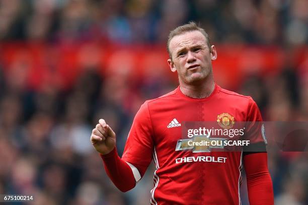 Manchester United's English striker Wayne Rooney reacts to the referee during the English Premier League football match between Manchester United and...