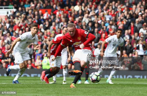Wayne Rooney of Manchester United scores his sides first goal during the Premier League match between Manchester United and Swansea City at Old...