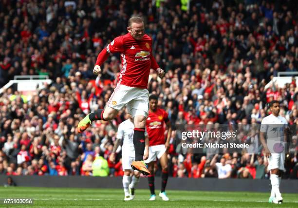 Wayne Rooney of Manchester United celebrates scoring his sides first goal during the Premier League match between Manchester United and Swansea City...