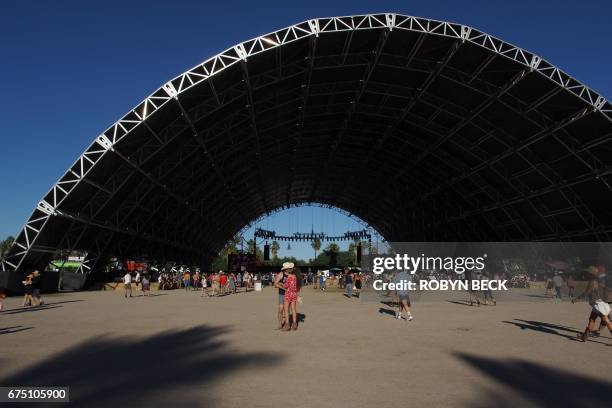 Couple kisses in front of the Palomino stage at the 2017 Stagecoach Country Music Festival at the Empire Polo Club on April 29, 2017 in Indio,...
