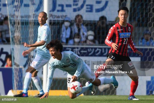 Koki Ogawa of Jubilo Iwata is challenged by Takuma Arano of Consadole Sapporo during the J.League J1 match between Jubilo Iwata and Consadole Sapporo...