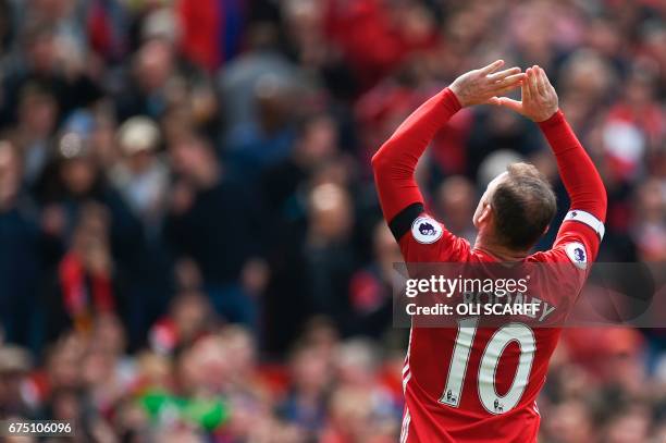 Manchester United's English striker Wayne Rooney celebrates scoring the opening goal during the English Premier League football match between...
