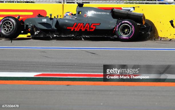 Romain Grosjean of France driving the Haas F1 Team Haas-Ferrari VF-17 Ferrari in the track barrier after crashing at the start during the Formula One...