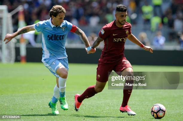 Lucas Biglia of SS Lazio compete for the ball with Emerson Palmieri of AS Roma during the Serie A match between AS Roma and SS Lazio at Stadio...