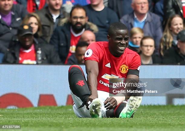 Eric Bailly of Manchester United lies injured during the Premier League match between Manchester United and Swansea City at Old Trafford on April 30,...