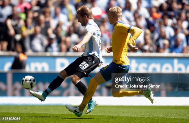 Stefan Aigner of Muenchen fights for the Ball with Saulo Decarli of Braunschweig during the Second Bundesliga match between TSV 1860 Muenchen and...