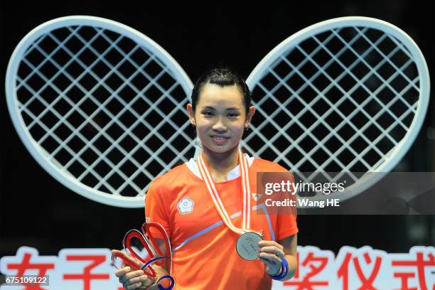 Tai Tzu Ying of Chinese Taipei poses with her gold medals on the podium after winning the women's singles against Akane Yamaguchi of Japan at the...