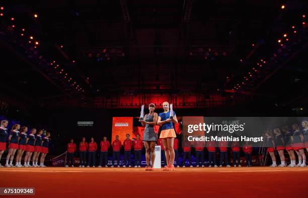 Raquel Atawo of the United States and Jelena Ostapenko of Latvia celebrate with the trophies after the doubles final against Abigail Spears of the...