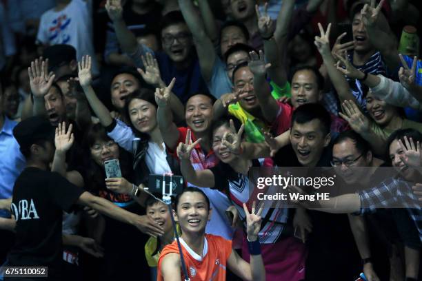 Tai Tzu Ying of Chinese Taipei poses for pictures with fans after winning women's singles final match against Akane Yamaguchi of Japan at the 2017...