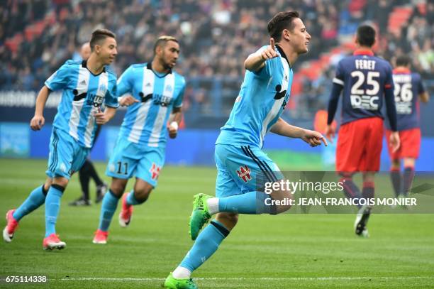 Olympique de Marseille's French midfielder Florian Thauvin reacts after scoring a goal during the French L1 football match between Caen and Marseille...