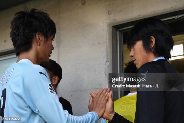 Shunsuke Nakamura of Jubilo Iwata consoles his team mate Koki Ogawa after their team's 2-2 draw in the J.League J1 match between Jubilo Iwata and...