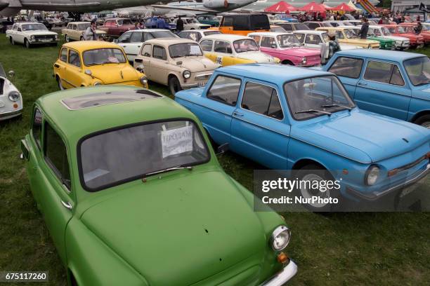 Visitor looks on an old car during the 'OldCarLand' motor show in Kyiv, Ukraine, 29 April 2017. About 900 old and exclusive cars , buses and...
