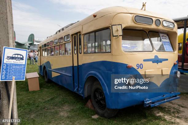 Visitor looks on an old car during the 'OldCarLand' motor show in Kyiv, Ukraine, 29 April 2017. About 900 old and exclusive cars , buses and...