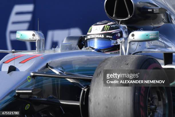 Mercedes' Finnish driver Valtteri Bottas drives to win the Formula One Russian Grand Prix at the Sochi Autodrom circuit in Sochi on April 30, 2017. /...