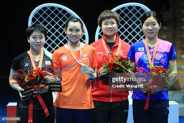 Akane Yamaguchi of Japan ,Tai Tzu Ying of Chinese Taipei , He Bing Jiao of China and Jang Mi Lee of South Korea pose with their medals on the podium...