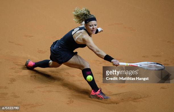Laura Siegemund of Germany lunges for a backhand during the singles final match against Kristina Mladenovic of France on Day 7 of the Porsche Tennis...