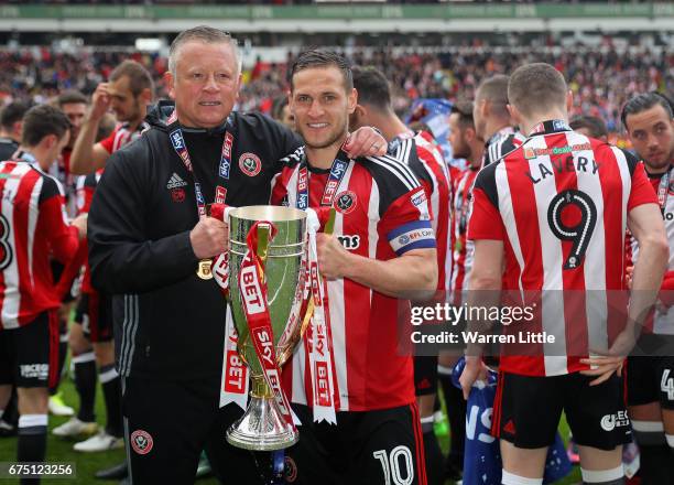 Chris Wilder, Sheffield United manager and Billy Sharp, Captain of Sheffield United celebrate as they win promotion into next seasons Sky Bet...