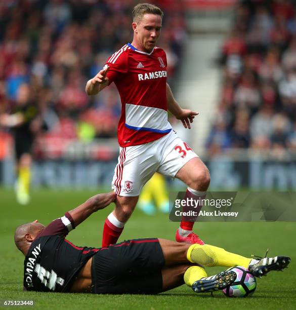 Vincent Kompany of Manchester City tackles Adam Forshaw of Middlesbrough during the Premier League match between Middlesbrough and Manchester City at...
