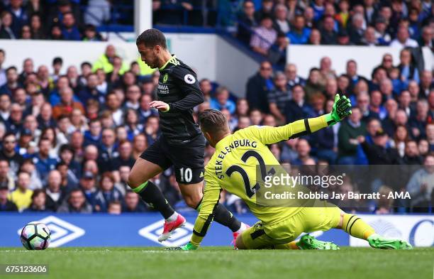 Eden Hazard of Chelsea and Maarten Stekelenburg of Everton during the Premier League match between Everton and Chelsea at Goodison Park on April 30,...